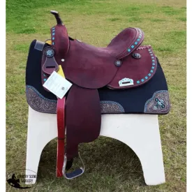 15", 16" Circle S Barrel Style Saddle with turquoise buckstitch trim.