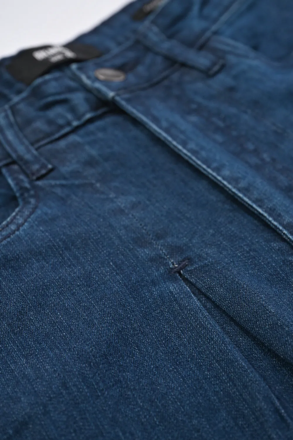 FLARED DENIM WITH RAW HEM